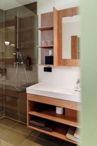 a bathroom with a sink and a shower at Schlafgut am Johanneshof in Tattendorf +43 photos