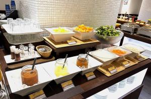 a buffet line with different types of food on display at Hotel Grand City in Tokyo