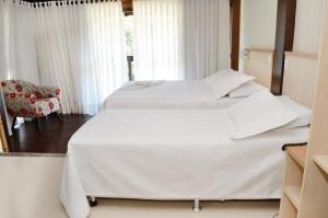 Een bed of bedden in een kamer bij Hotel Steinhausen Colonial