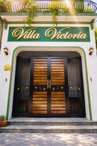 a pair of doors to a villa victoria at Victoria Villa 2 in Hue