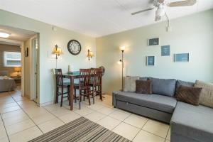 a living room with a couch and a table at Oceanfront Condo w Heated Pool & Reserved Parking in Wildwood Crest