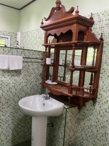 a bathroom with a sink and a toilet and a mirror at Mairood Resort in Ban Mai Rut +33 photos