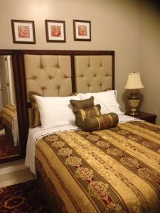 a bedroom with a large bed with white pillows at Great Clean in New Orleans