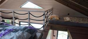 a room with two bunk beds and a window at Tiny house Roman in Hostinné