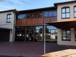 a large building with a lot of windows at Merensee in Langebaan