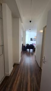an empty hallway with a room with a table in it at Perfectly Located, Surprisingly Quiet in Gouda