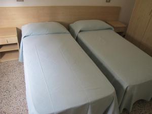 Postel nebo postele na pokoji v ubytování Hotel Niagara