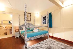 Ein Bett oder Betten in einem Zimmer der Unterkunft Villa Alam Biru Gardenia