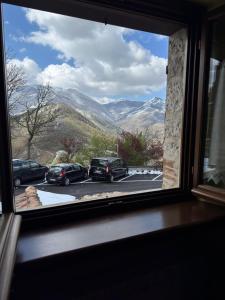 a view of a mountain from a window at Locanda del Castello in Frontone