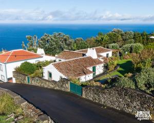 an aerial view of a house with the ocean in the background at Casa da Serreta by PontaNegraAzores in Serreta