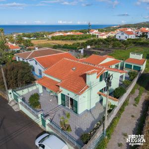 an aerial view of a house with an orange roof at Casa Martins by PontaNegraAzores in Biscoitos