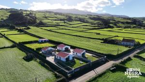 an aerial view of a house in the middle of a field at Photography House by PontaNegraAzores in Altares