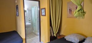 a bedroom with a mirror and a bathroom with a shower at LEFOUXIOL in La Trinité +40 photos