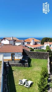 a villa with a view of the ocean at Casa da Gente by PontaNegraAzores in Biscoitos