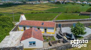 an overhead view of a house with a red roof at Recanto das 5 by PontaNegraAzores in Cinco Ribeiras