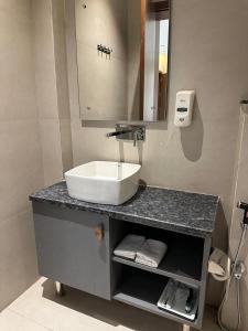 a bathroom with a sink and a mirror at ANANTYA BANQUET and HOTEL in Sonīpat +21 photos