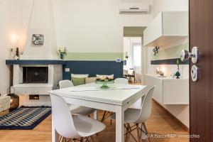 a kitchen and dining room with a white table and chairs at Mint House in Vasto +26 photos