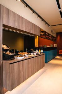 a buffet line with many plates of food at Ku Private Milano in Pero