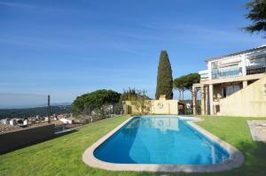 a swimming pool in the yard of a house at Quatre vents Ref 163 in Begur
