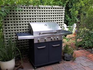 a barbecue grill with a smoker on a patio at The old Chiltern bank BnB in Chiltern