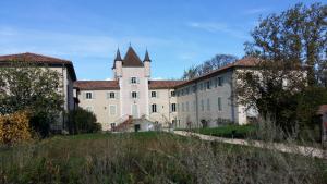 an old building with a tower on top of it at Hôtel La Gravenne in Thueyts