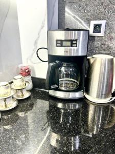 a coffee maker sitting on top of a counter at Airport agadir villa in Agadir