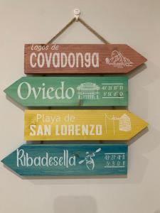 a group of signs hanging on a wall at El Cierrón - apartamento con terrazas! in Villaviciosa +22 photos