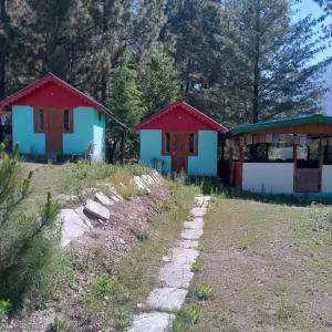 a group of houses in a field at Shoolin camping in Jari +2 photos