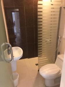 a bathroom with a toilet and a sink at Nawara NASR - Economic in Riyadh +8 photos