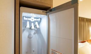 a glass door of a shower in a room at 신촌 APL Hotel in Seoul +62 photos