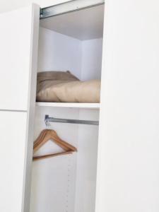 a room with a closet with a bed in it at Skyline Villas Room in Calheta