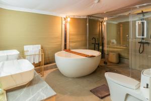 a bathroom with a tub and a shower and a sink at The Vineyard Hideaway Khaoyai in Ban Wang Phaem +73 photos