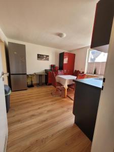 a room with a kitchen and a living room at Charlotte II in Neustadt bei Coburg