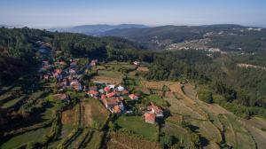an aerial view of a village in the hills at Cabanelas Country House - Casa do Afonso in Vale de Cambra
