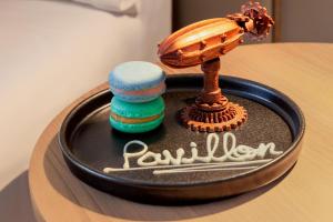 a cake with a toy on top of a table at NH Bogota Pavillon Royal in Bogotá