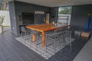 a kitchen with a wooden table and chairs at 3066 Water Edge in Parys