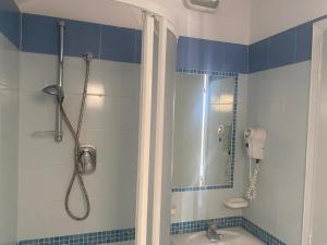 a bathroom with a shower and a sink at Hotel HARRY'S Hospitality Riccione-Fronte Mare in Riccione +35 photos