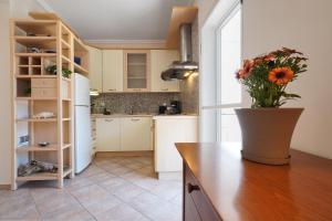 a kitchen with a vase of flowers on a counter at Avra breeze in Kriopigi