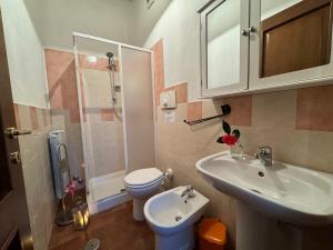 a bathroom with a sink and a toilet and a shower at Podere di Mero Casolare in Buti +83 photos