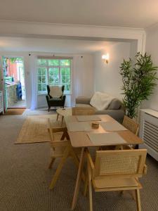 a living room with a table and a couch at Richmond Escape in Richmond upon Thames