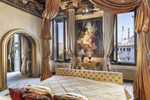 a bedroom with a bed and a painting on the wall at Domus 3 Badroom Piazza Venezia in Rome