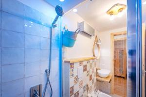 a bathroom with a shower with a sink and a toilet at Guest Art Campitello Matese in Campobasso