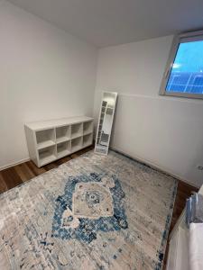 a room with a rug on the floor and a window at Avella House in Mühlheim