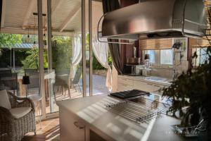 a kitchen with a sink and a stove top oven at Villa Arta in Drage