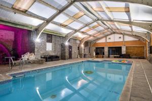 a large swimming pool with a glass ceiling at Finest Retreats - Trimstone Manor, Manor Cottage in Woolacombe