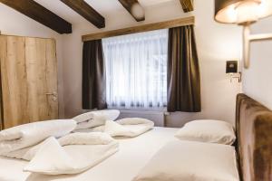 A bed or beds in a room at A Casa Juwel Apartment