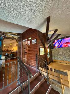 a room with wooden walls and stairs in a building at Konaci kod Bobe in (( Vratna ))