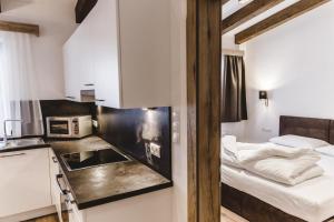 A bed or beds in a room at A Casa Juwel Apartment
