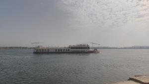 a large boat in the middle of the water at Isis Hotel Nile View in Aswan