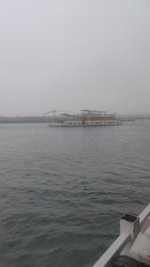 a dock in the middle of a body of water at Isis Hotel Nile View in Aswan